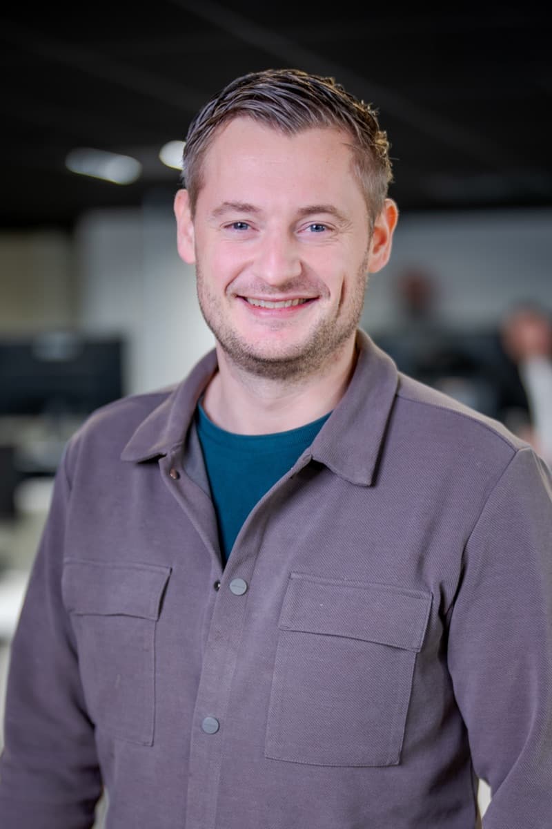 Portrait of Arjen de Groot, co-founder of Converseon