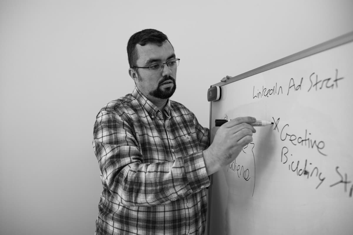 Kristian Downer mapping out a LinkedIn Ads strategy on a whiteboard
