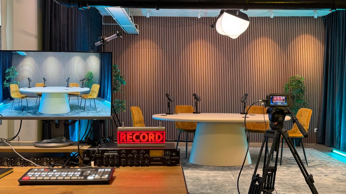 The Trenchcoat podcast studio with cameras and a recording light