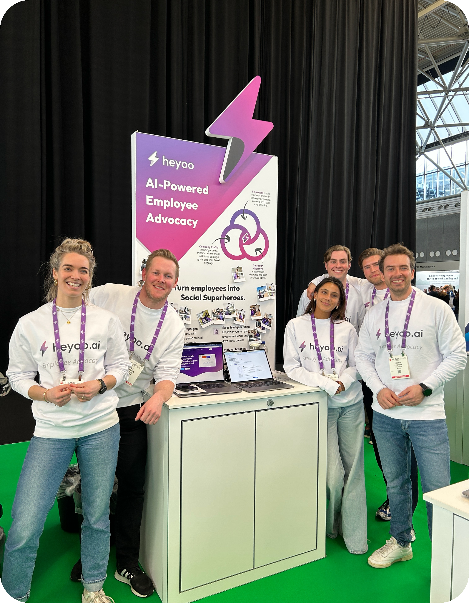 The Heyoo team at a conference booth